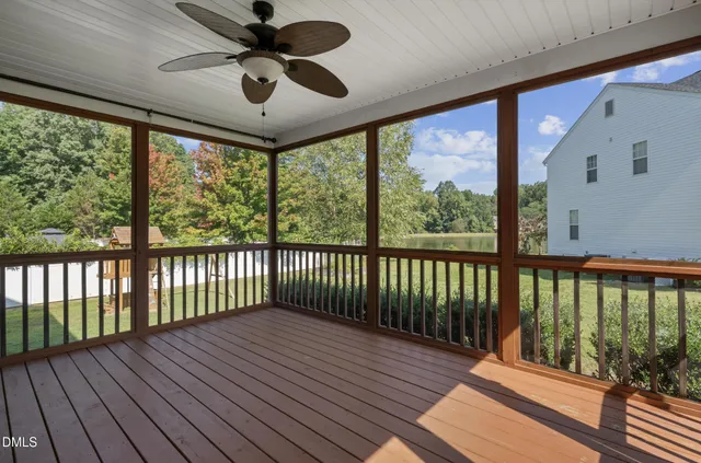 a view of a balcony with wooden floor