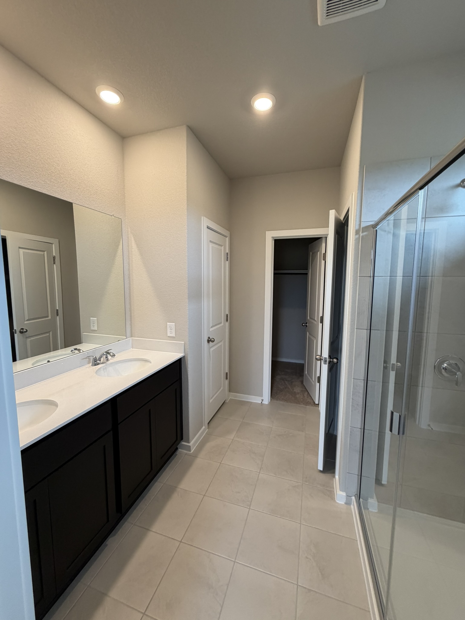 25536 Flora Bella Lane Elgin, TX 78621 - Photo 5 of 19 Primary Bath with dual vanities and walk-in shower