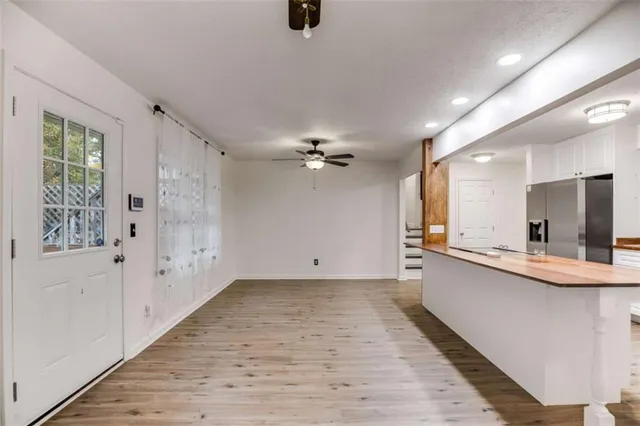 a view of a kitchen with electric appliances