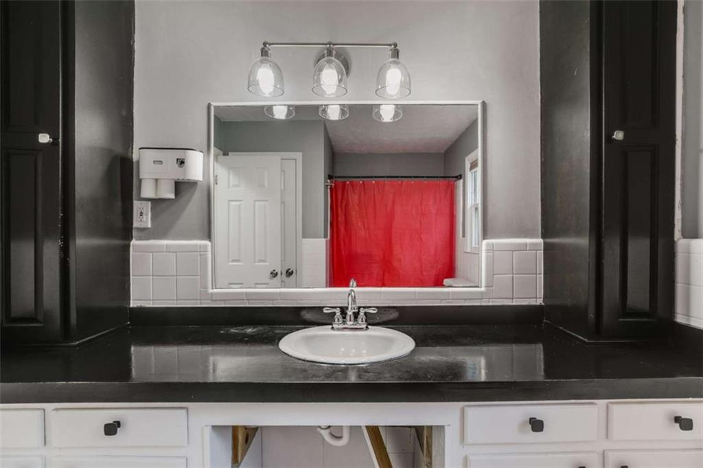 104 Eaves Road Bremen, GA 30110 - Photo 13 of 29 a bathroom with a sink and a mirror