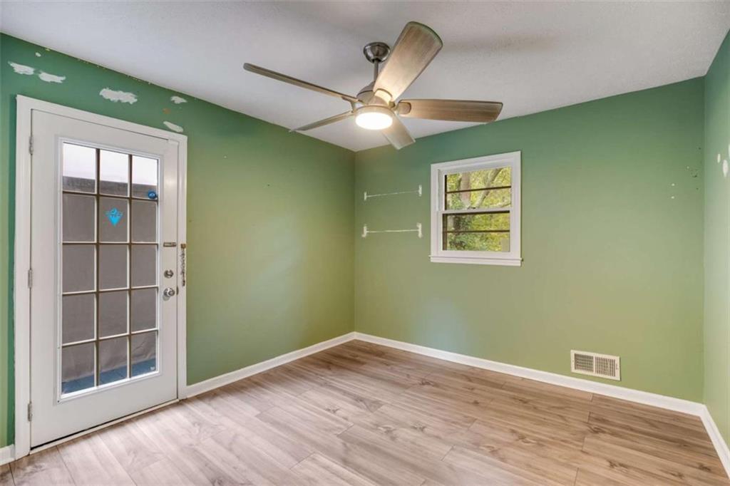 104 Eaves Road Bremen, GA 30110 - Photo 15 of 29 a view of empty room with wooden floor and fan