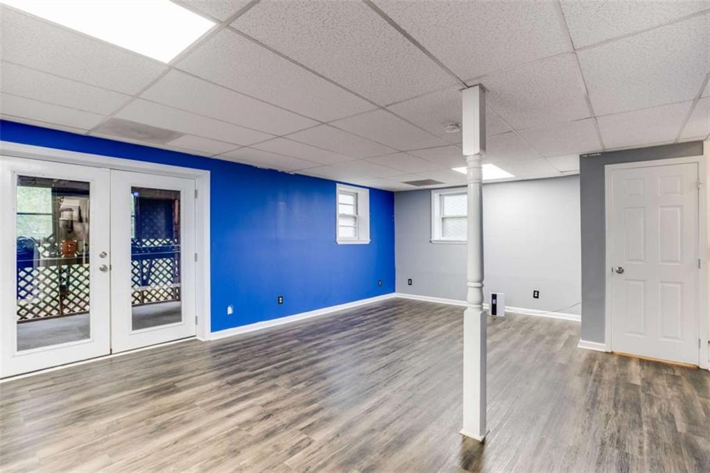 104 Eaves Road Bremen, GA 30110 - Photo 17 of 29 a view of an empty room with window and wooden floor