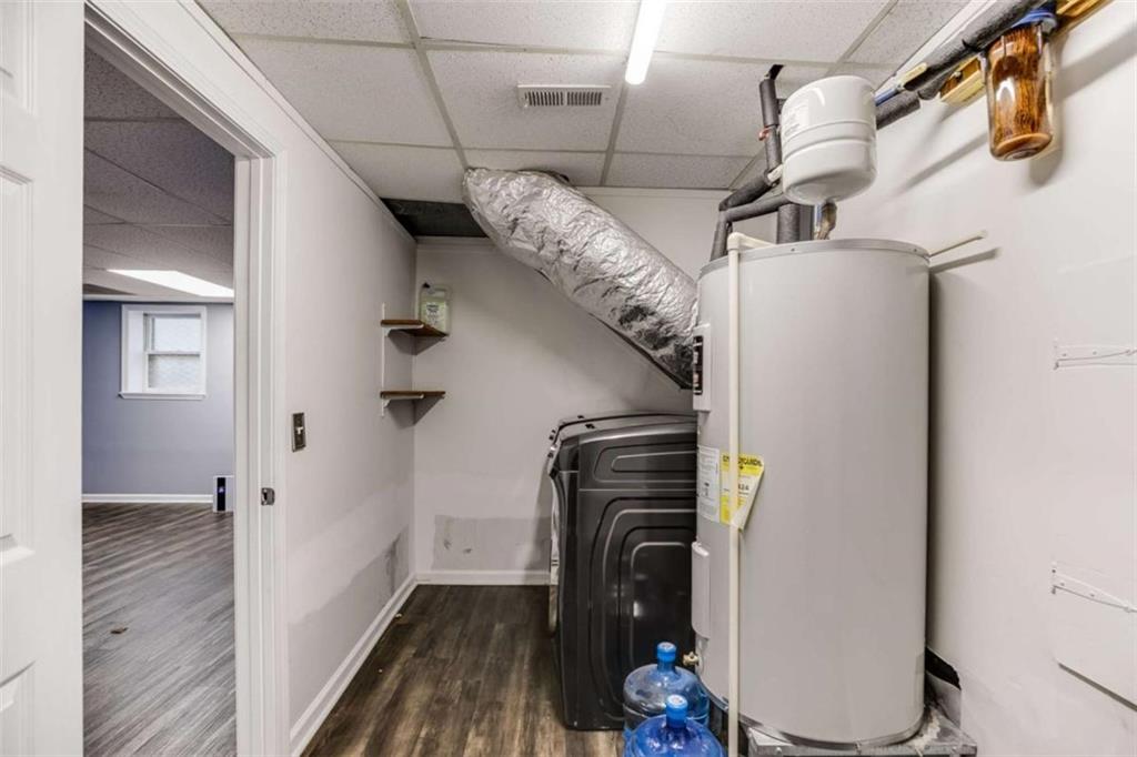 104 Eaves Road Bremen, GA 30110 - Photo 19 of 29 a view of hallway with stairs and wooden floor