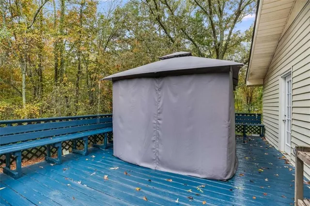 a backyard of a house with wooden floor