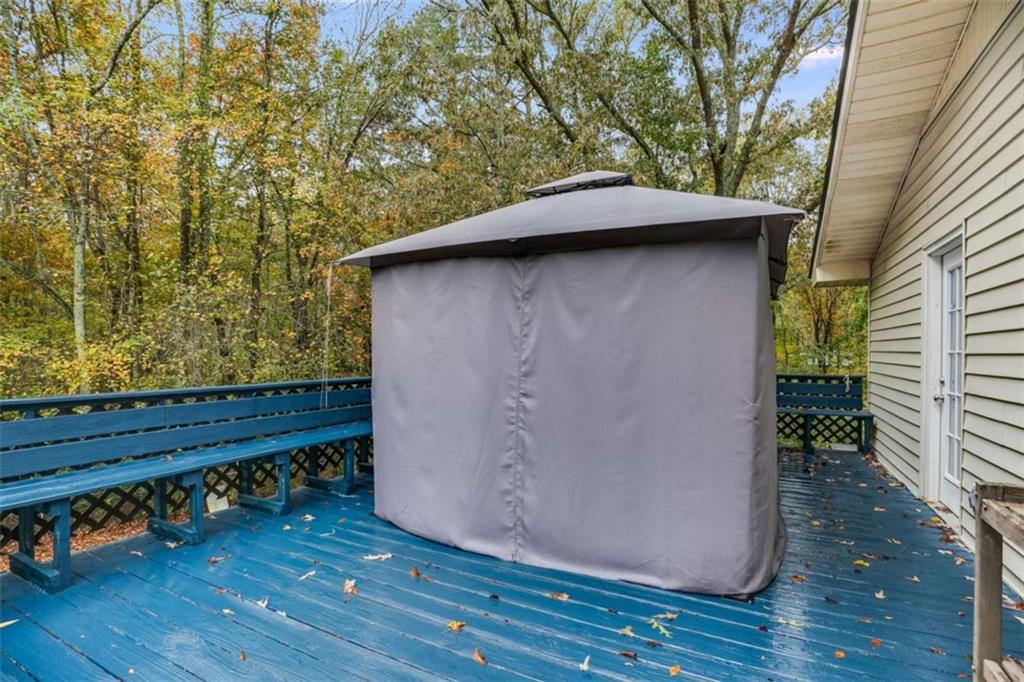104 Eaves Road Bremen, GA 30110 - Photo 24 of 29 a backyard of a house with wooden floor