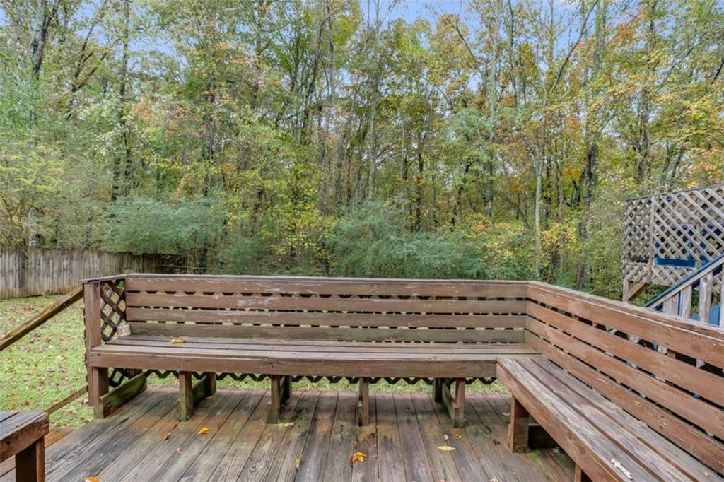 104 Eaves Road Bremen, GA 30110 - Photo 25 of 29 a view of a wooden bench next to a yard