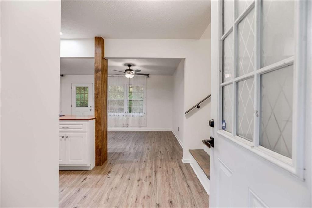 104 Eaves Road Bremen, GA 30110 - Photo 4 of 29 a view of a hallway with wooden floor and staircase