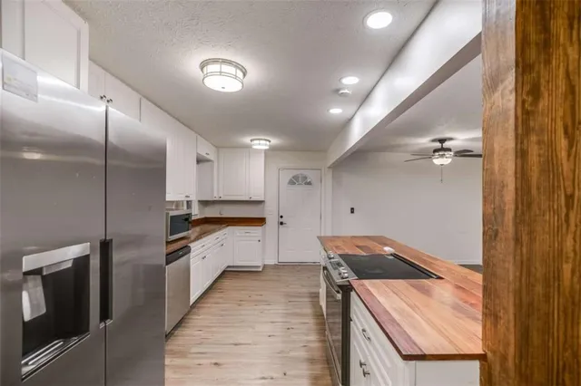 a kitchen with a sink stove and refrigerator