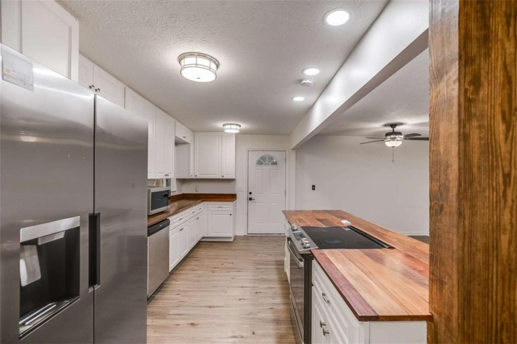 104 Eaves Road Bremen, GA 30110 - Photo 5 of 29 a kitchen with a sink stove and refrigerator