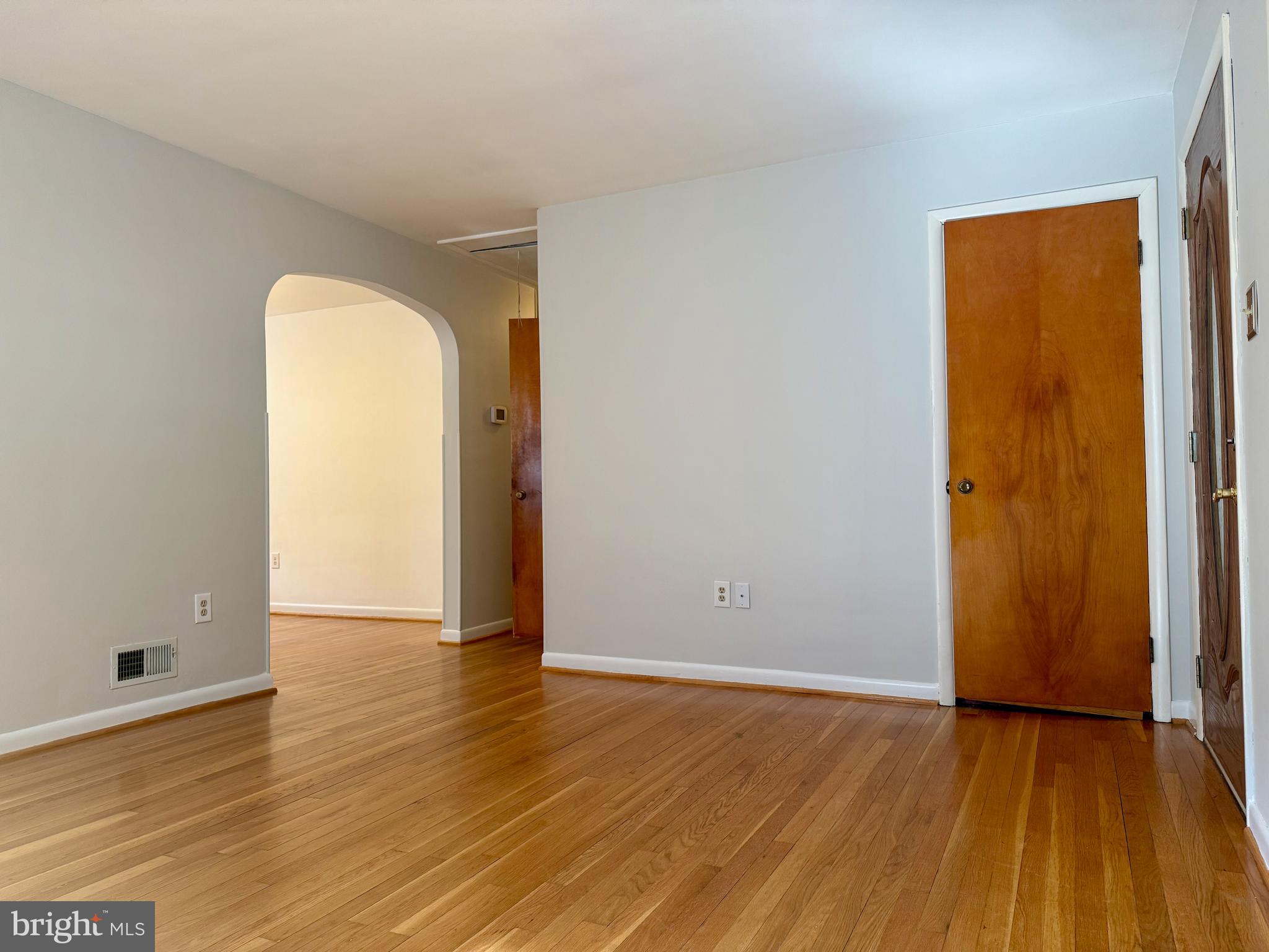 3817 Schroeder Avenue Perry Hall, MD 21128 - Photo 21 of 48 an empty room with wooden floor and a window