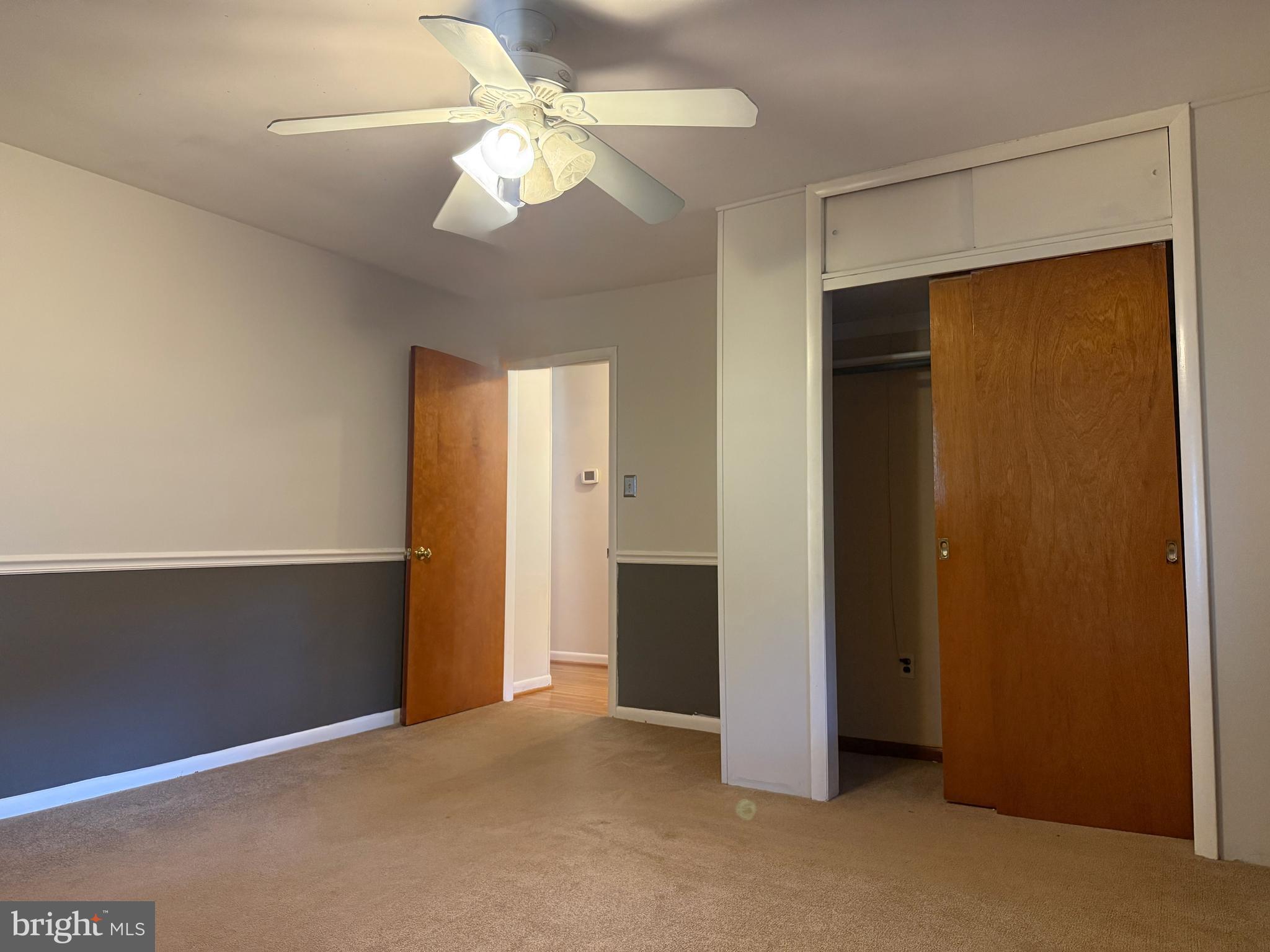3817 Schroeder Avenue Perry Hall, MD 21128 - Photo 23 of 48 an empty room with closet and a ceiling fan