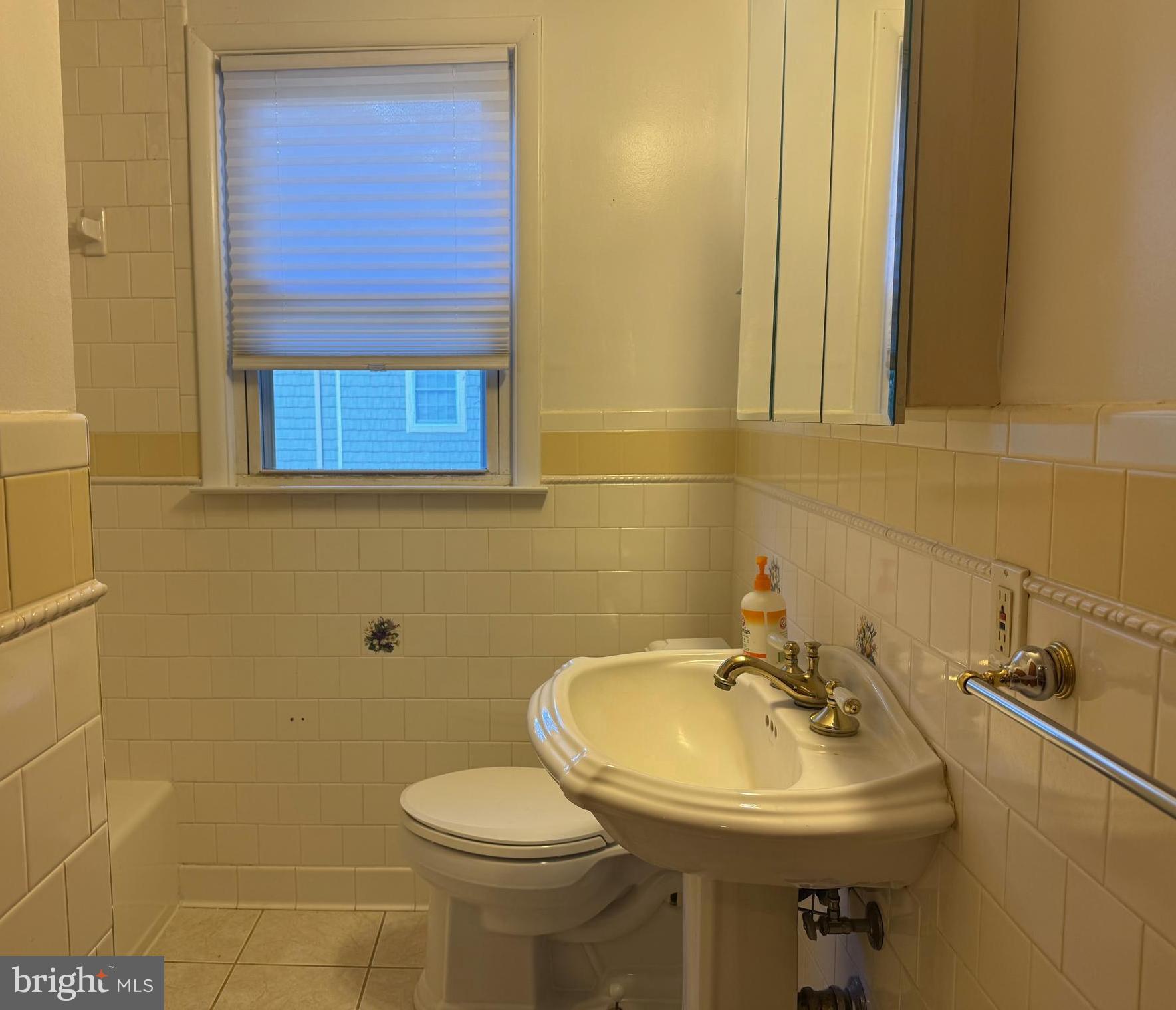 3817 Schroeder Avenue Perry Hall, MD 21128 - Photo 25 of 48 a bathroom with a sink toilet and a mirror