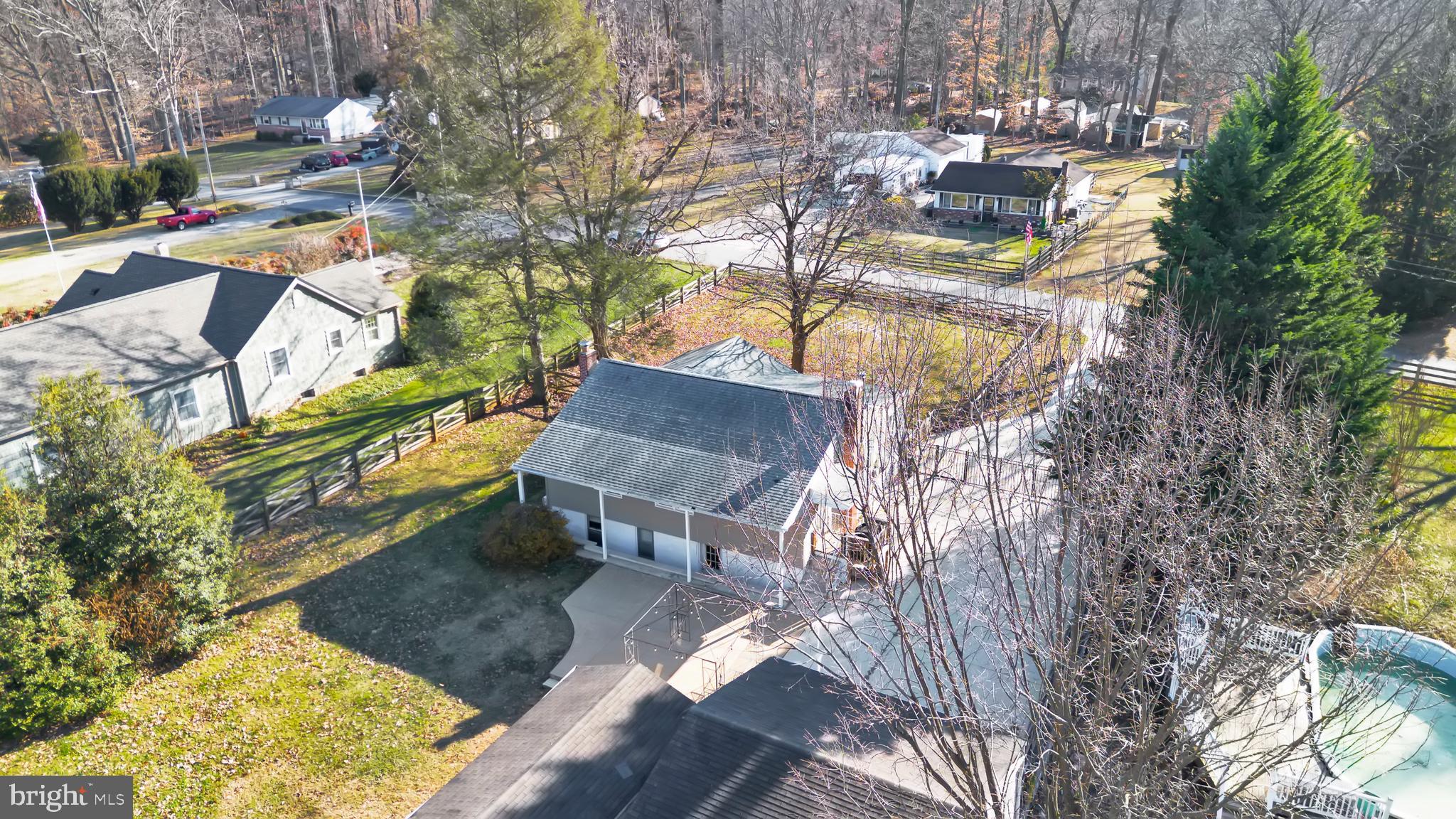 3817 Schroeder Avenue Perry Hall, MD 21128 - Photo 44 of 48 a view of a patio with table and chairs with wooden fence and plants
