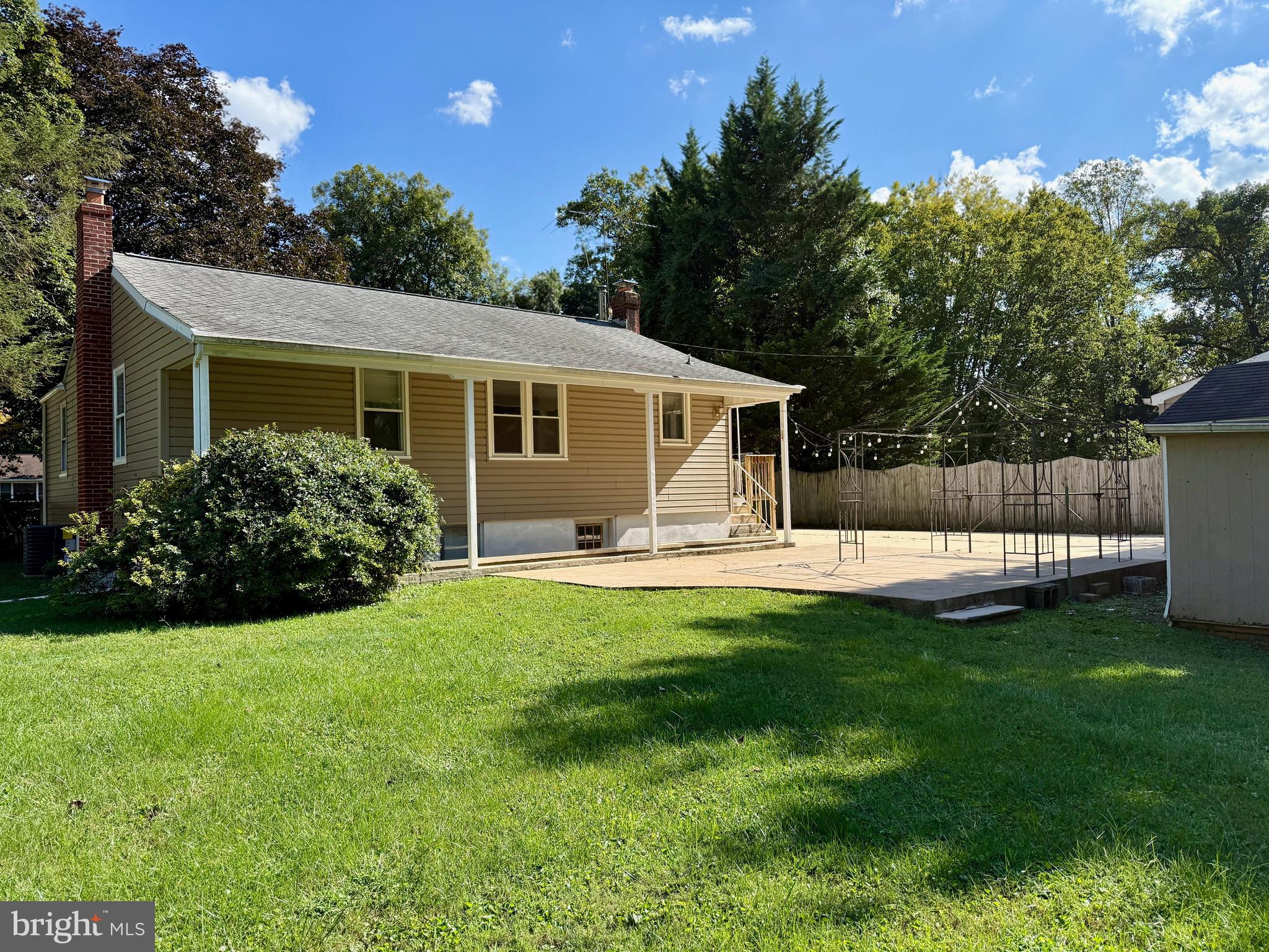 3817 Schroeder Avenue Perry Hall, MD 21128 - Photo 10 of 48 a view of a house with a backyard and a patio