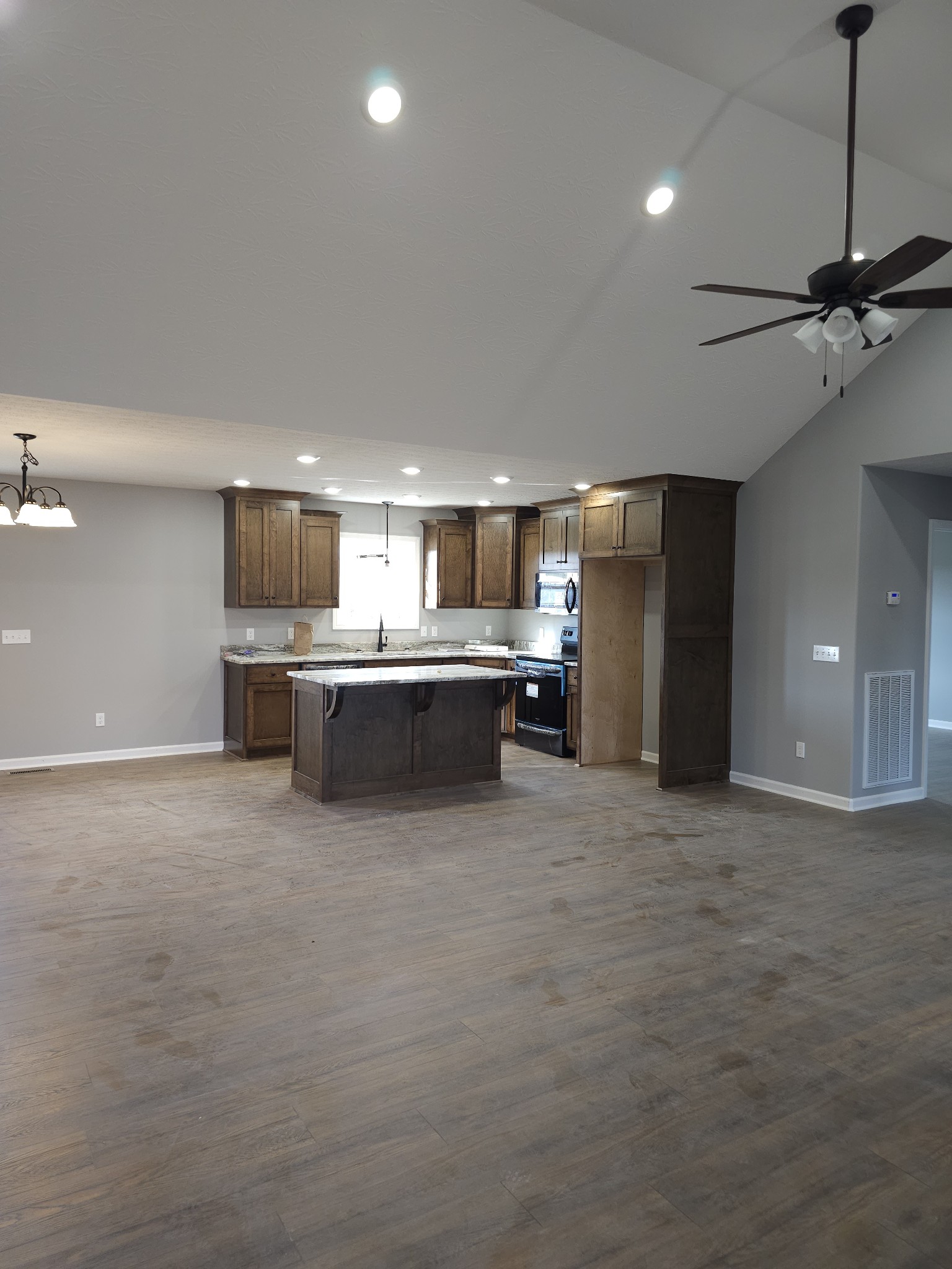 5209 Galen Road Lafayette, TN 37083 - Photo 3 of 24 a large kitchen with stainless steel appliances a refrigerator and a sink