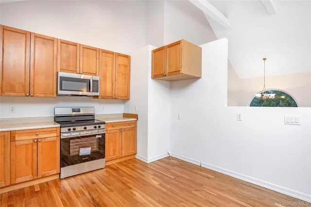 a view of a livingroom with wooden floor