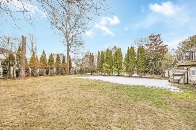 a swimming pool with outdoor seating and yard