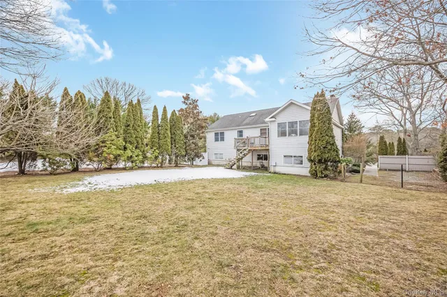 a view of a white house with a snow