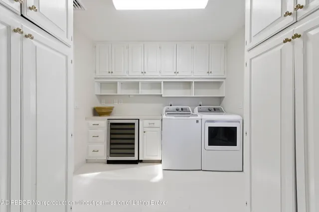 a bedroom with a bed and a large window with balcony view