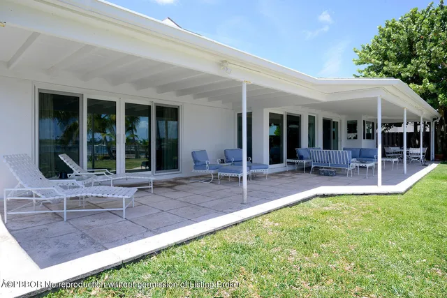 a view of a swimming pool and trees in the background