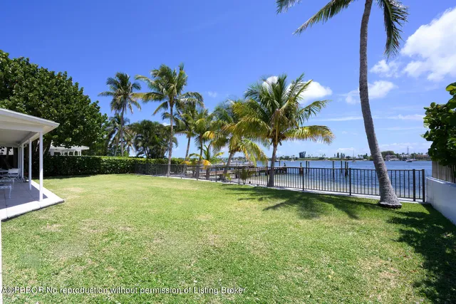an aerial view of a houses with outdoor space and ocean view