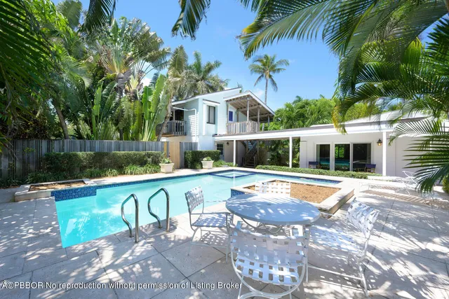 a view of a swimming pool with a patio