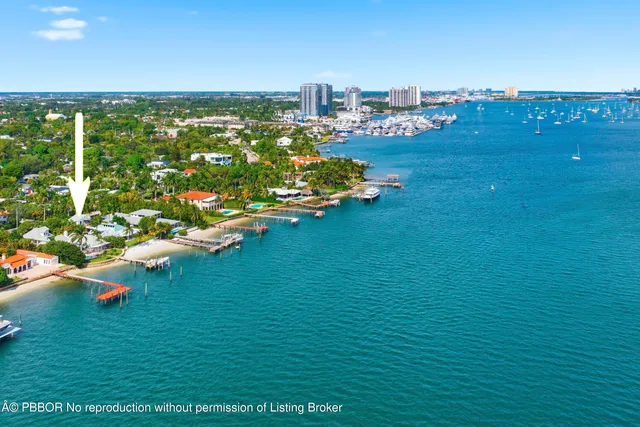 a bathroom with a sink shower and a mirror