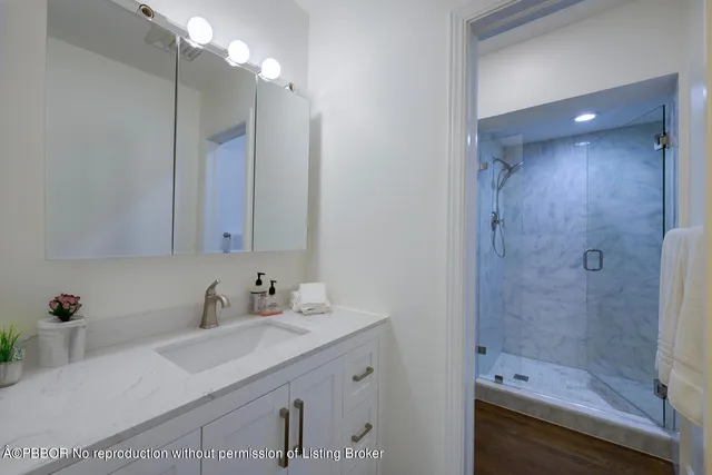 a bedroom with furniture and a flat screen tv