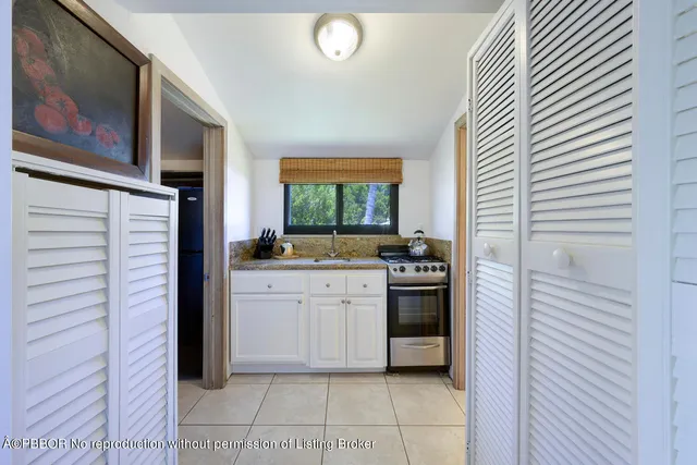 a bedroom with furniture and a rug