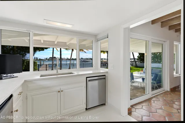 a kitchen with stainless steel appliances a stove a refrigerator and cabinets