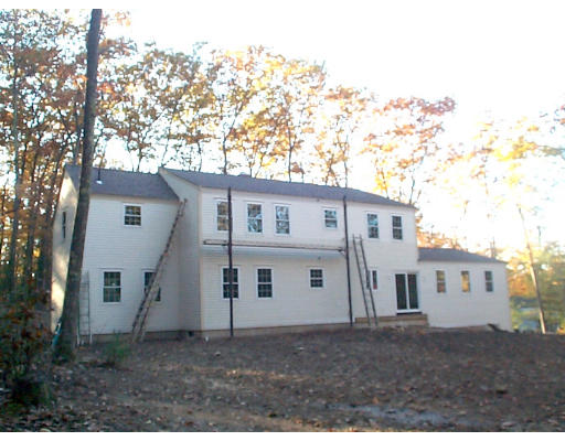 47 Depot Road Leverett, MA 01054 - Photo 2 of 2 a view of a white house next to a yard with big trees