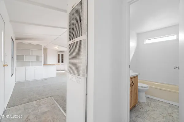 a bathroom with a bathtub and toilet