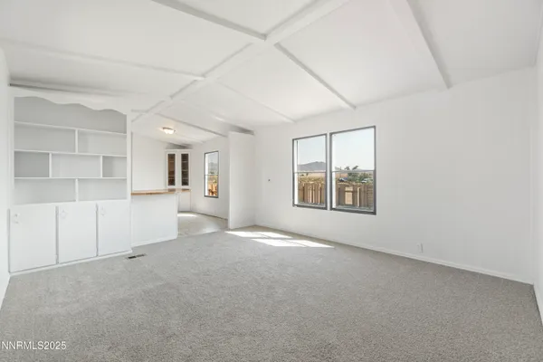 an empty room with a empty space and window