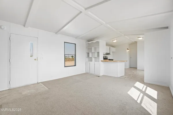 a view of a kitchen with a sink and a window