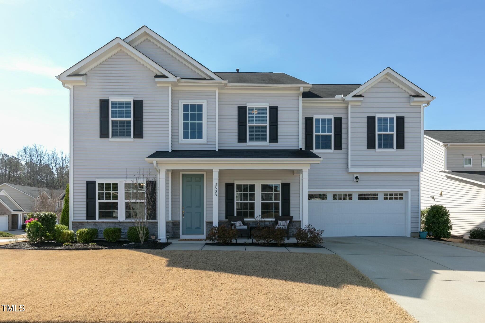 3508 Longleaf Estates Drive Raleigh, NC 27616 - Photo 1 of 45 a front view of a house with a yard and a garage