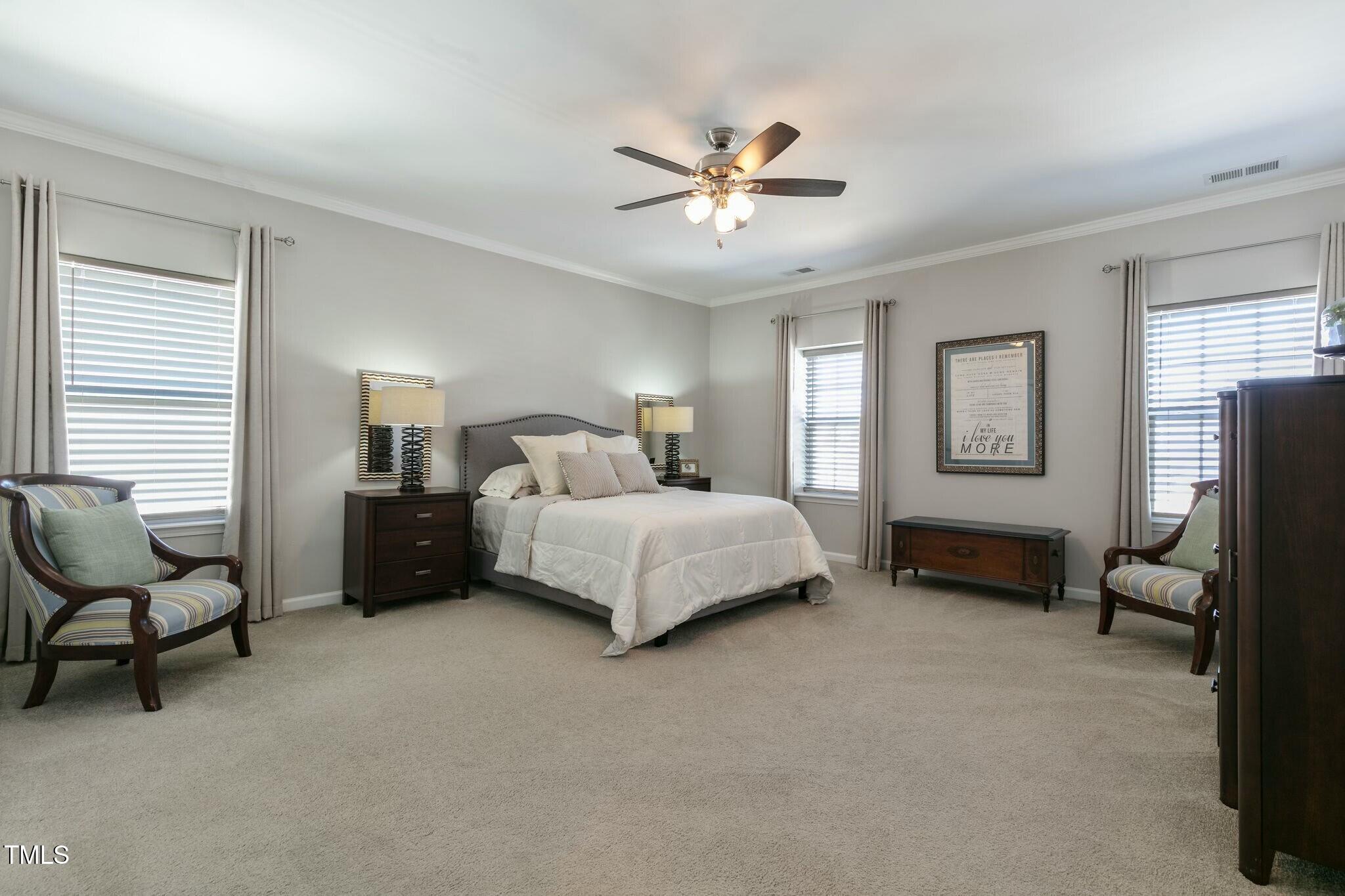 3508 Longleaf Estates Drive Raleigh, NC 27616 - Photo 22 of 45 a bedroom with a bed couch and window