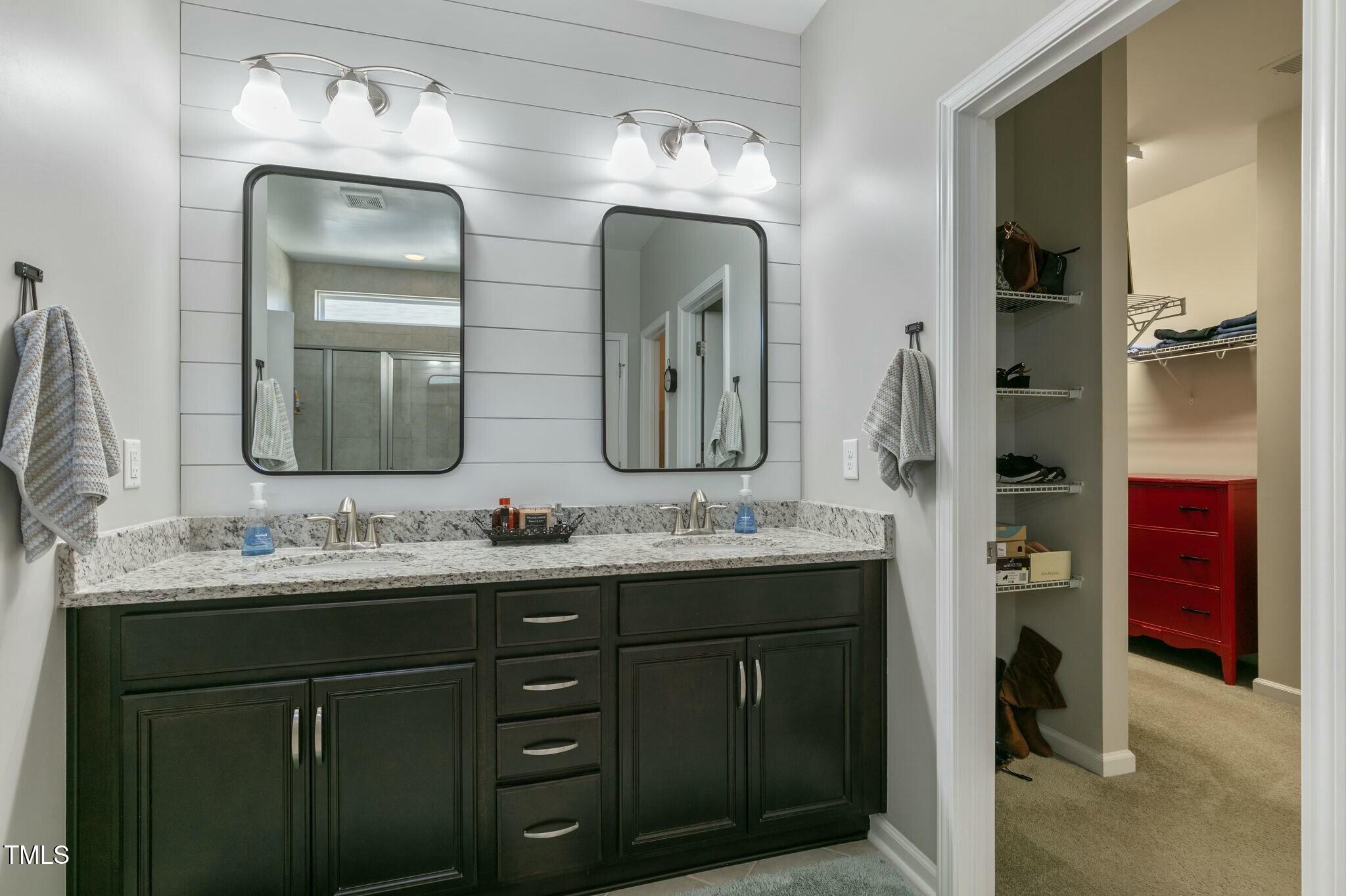 3508 Longleaf Estates Drive Raleigh, NC 27616 - Photo 25 of 45 a bathroom with a double vanity sink and a mirror