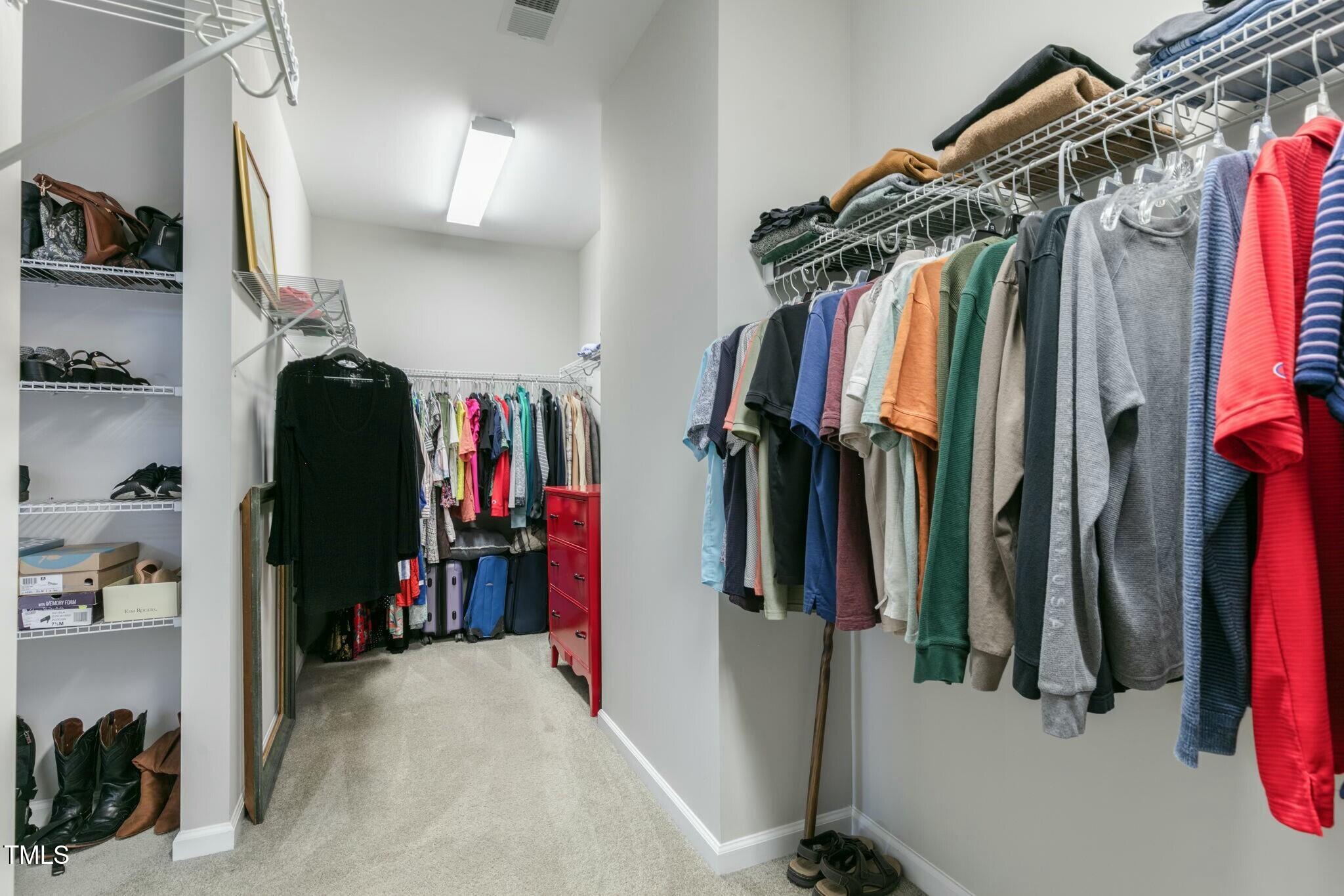 3508 Longleaf Estates Drive Raleigh, NC 27616 - Photo 27 of 45 a view of walk in closet with clothes and shoes