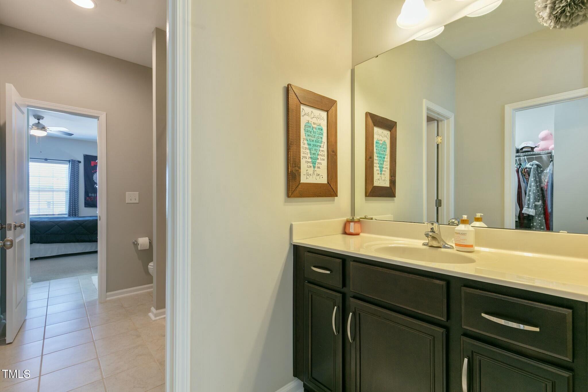 3508 Longleaf Estates Drive Raleigh, NC 27616 - Photo 32 of 45 a bathroom with a sink and a mirror