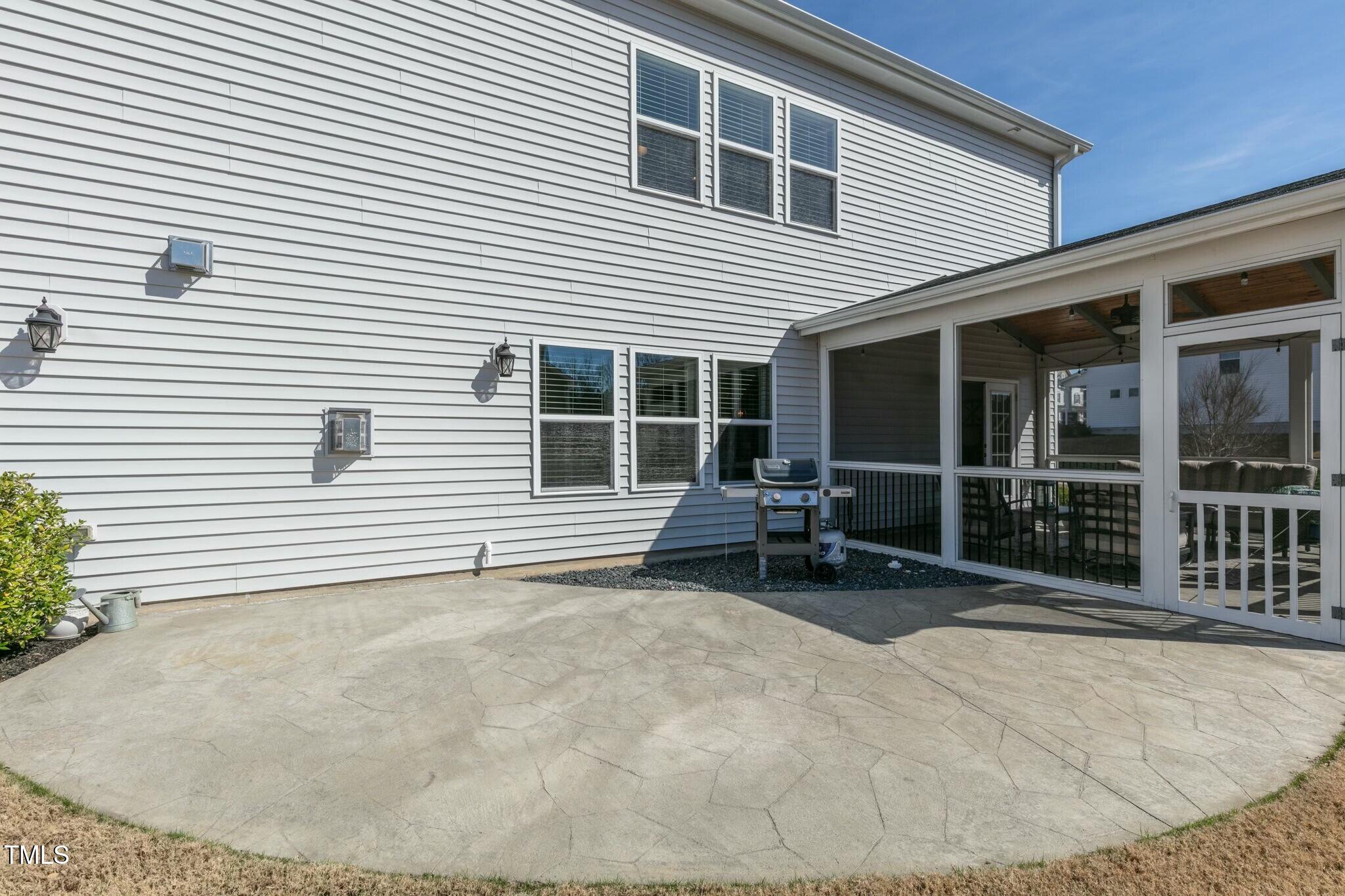 3508 Longleaf Estates Drive Raleigh, NC 27616 - Photo 39 of 45 a backyard of a house with table and chairs