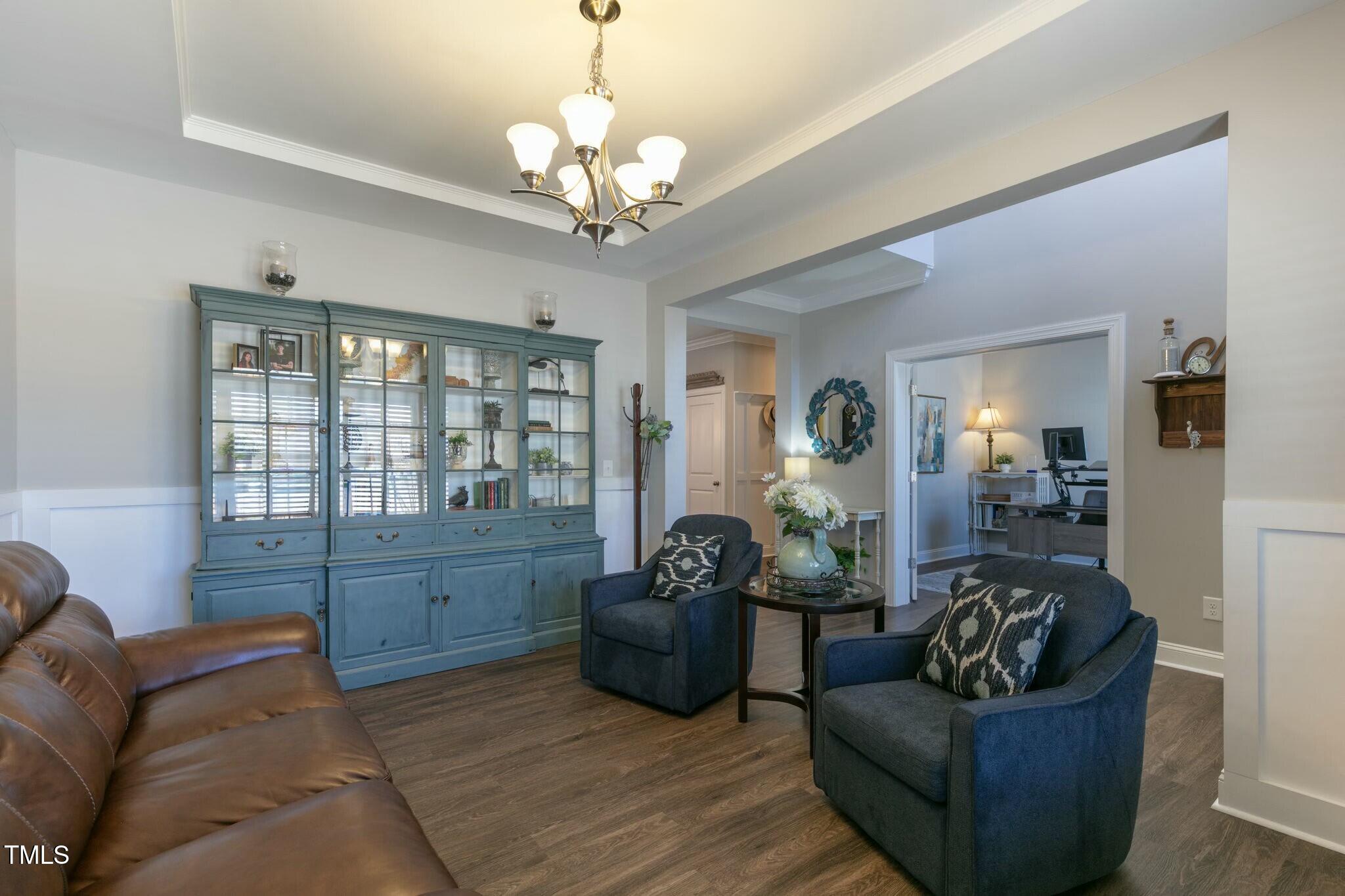 3508 Longleaf Estates Drive Raleigh, NC 27616 - Photo 5 of 45 a living room with furniture and a chandelier