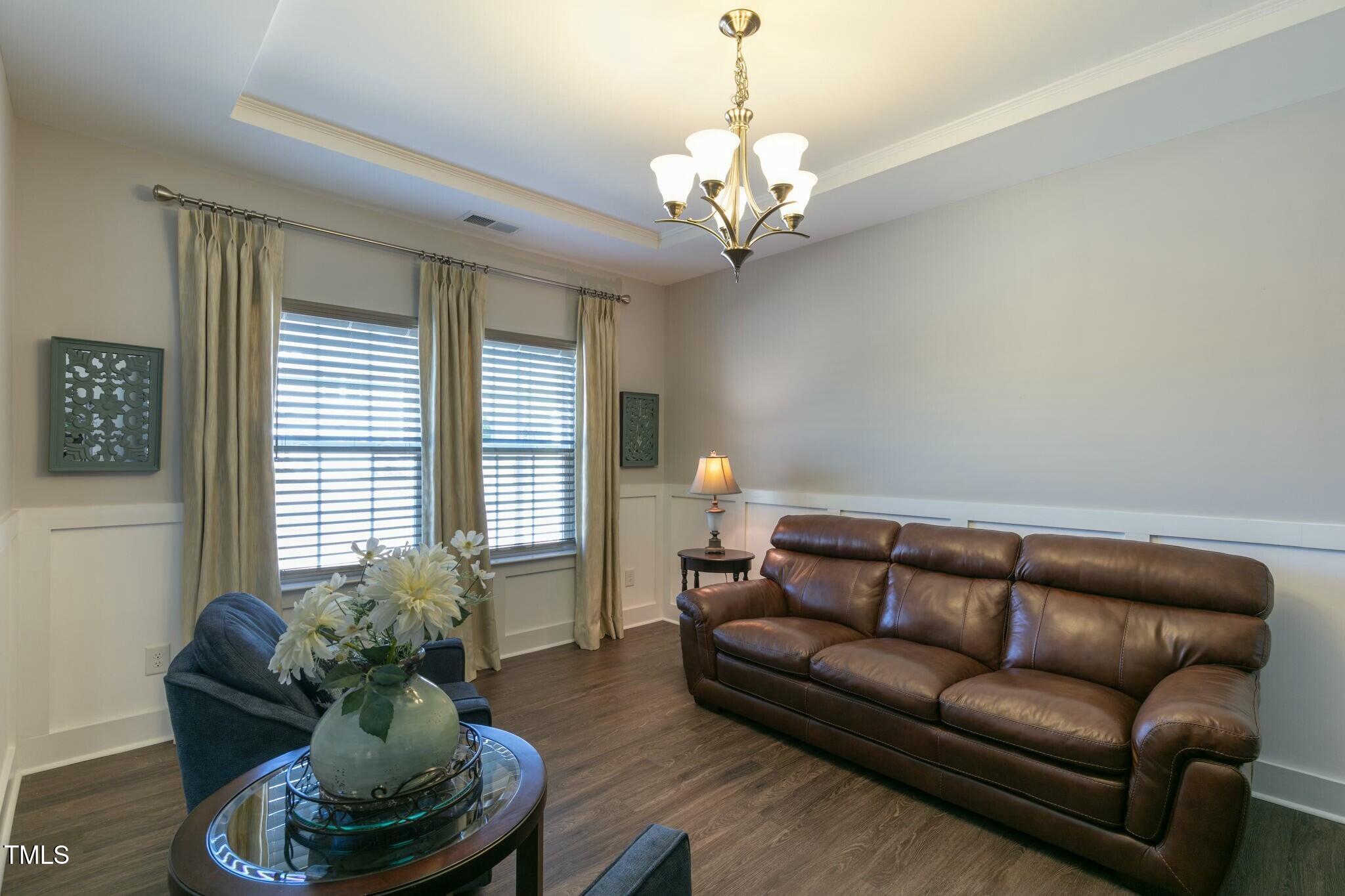 3508 Longleaf Estates Drive Raleigh, NC 27616 - Photo 6 of 45 a living room with furniture and a chandelier
