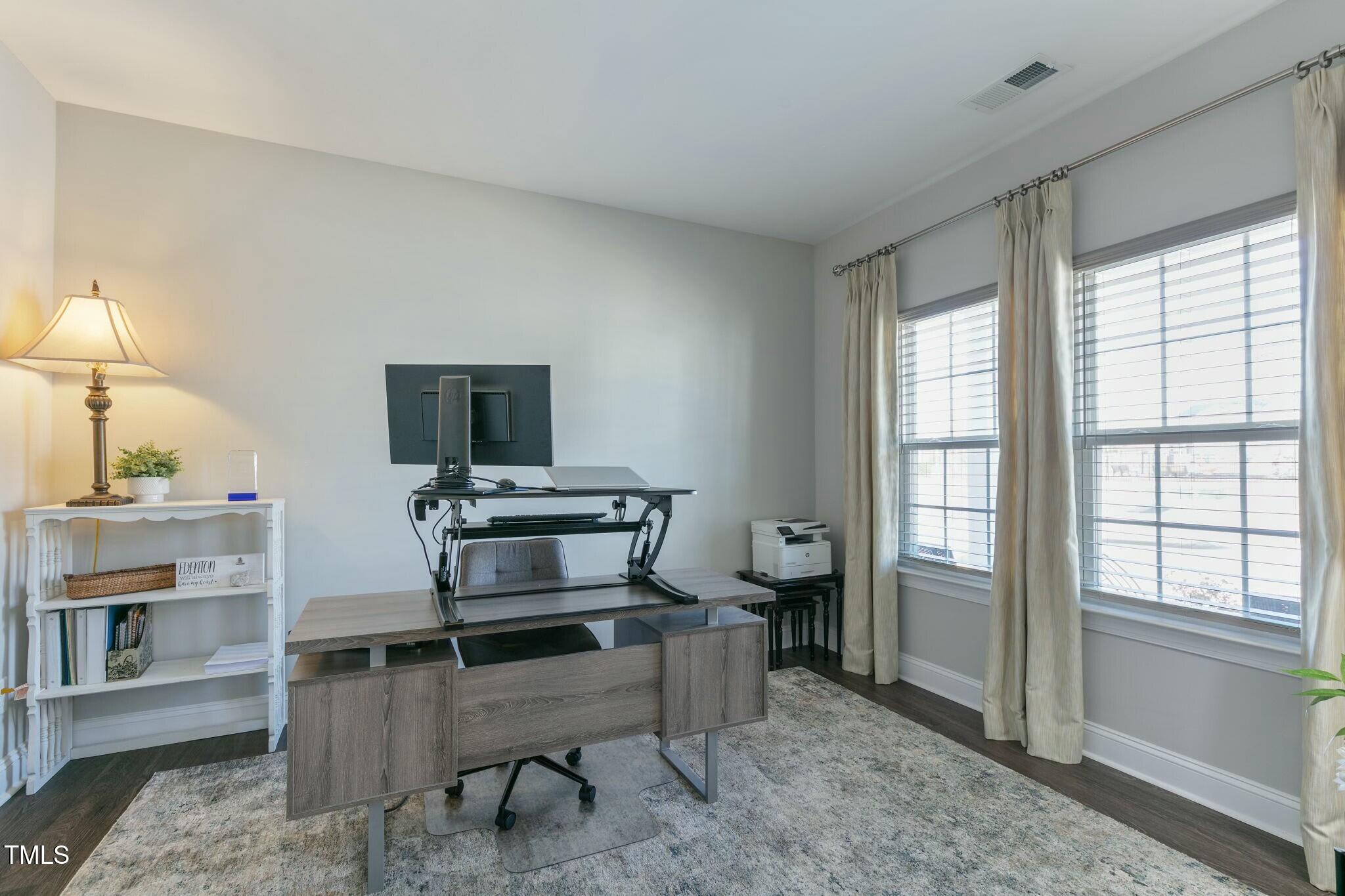 3508 Longleaf Estates Drive Raleigh, NC 27616 - Photo 7 of 45 a living room with furniture a window and a flat screen tv