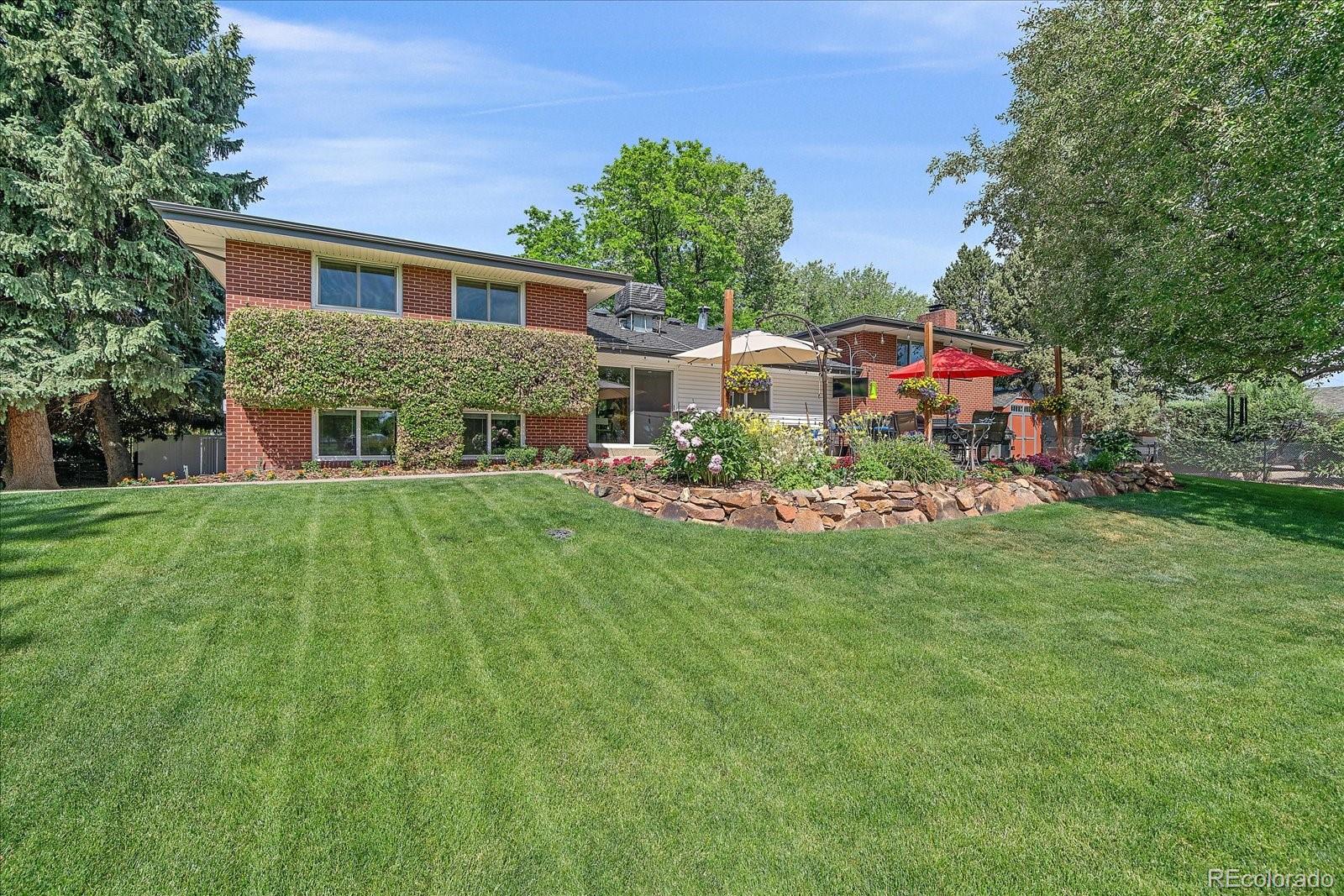 930 Reed Court Lakewood, CO 80214 - Photo 36 of 41 a front view of house with yard and green space