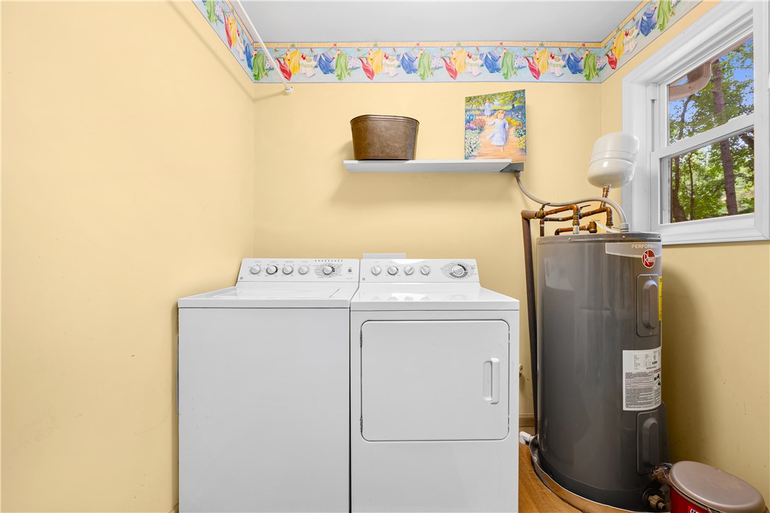 139 Tulip Lane Westminster, SC 29693 - Photo 27 of 37 A well-organized laundry room features essential appliances and a bright window.