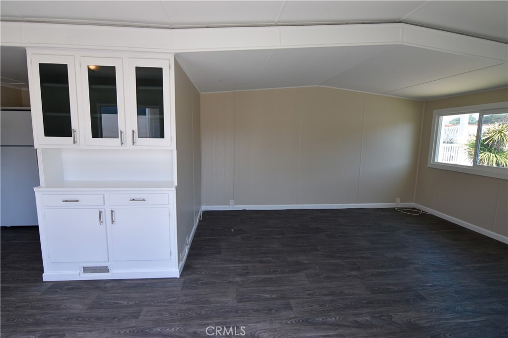 109 1st Avenue, Unit 3 Pacifica, CA 94044 - Photo 4 of 23 an empty room with wooden floor and windows