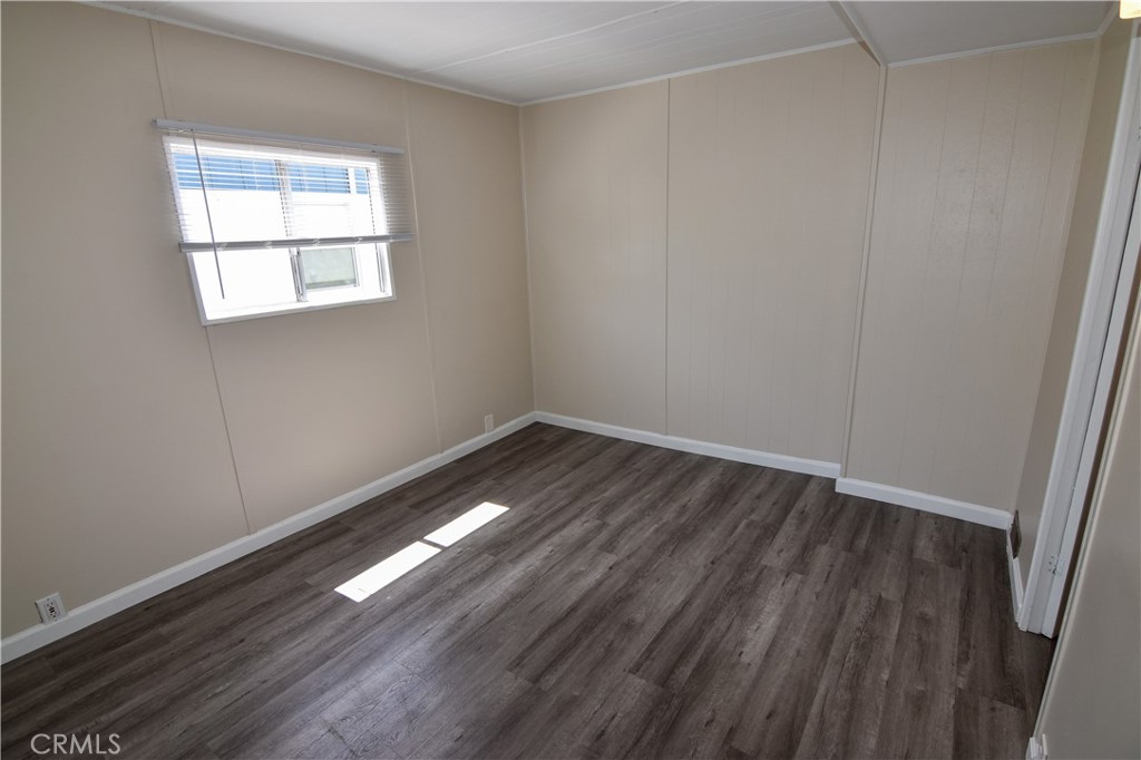 109 1st Avenue, Unit 3 Pacifica, CA 94044 - Photo 9 of 23 an empty room with wooden floor and windows