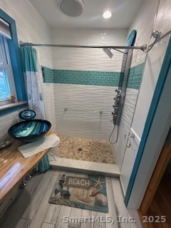 15 Paradiso Street, Unit 1 Norwalk, CT 06854 - Photo 14 of 16 a bathroom with a bathtub and a shower