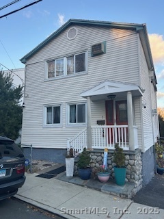 15 Paradiso Street, Unit 1 Norwalk, CT 06854 - Photo 16 of 16 a front view of a house with a yard