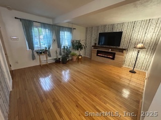 15 Paradiso Street, Unit 1 Norwalk, CT 06854 - Photo 2 of 16 a living room with furniture and a flat screen tv